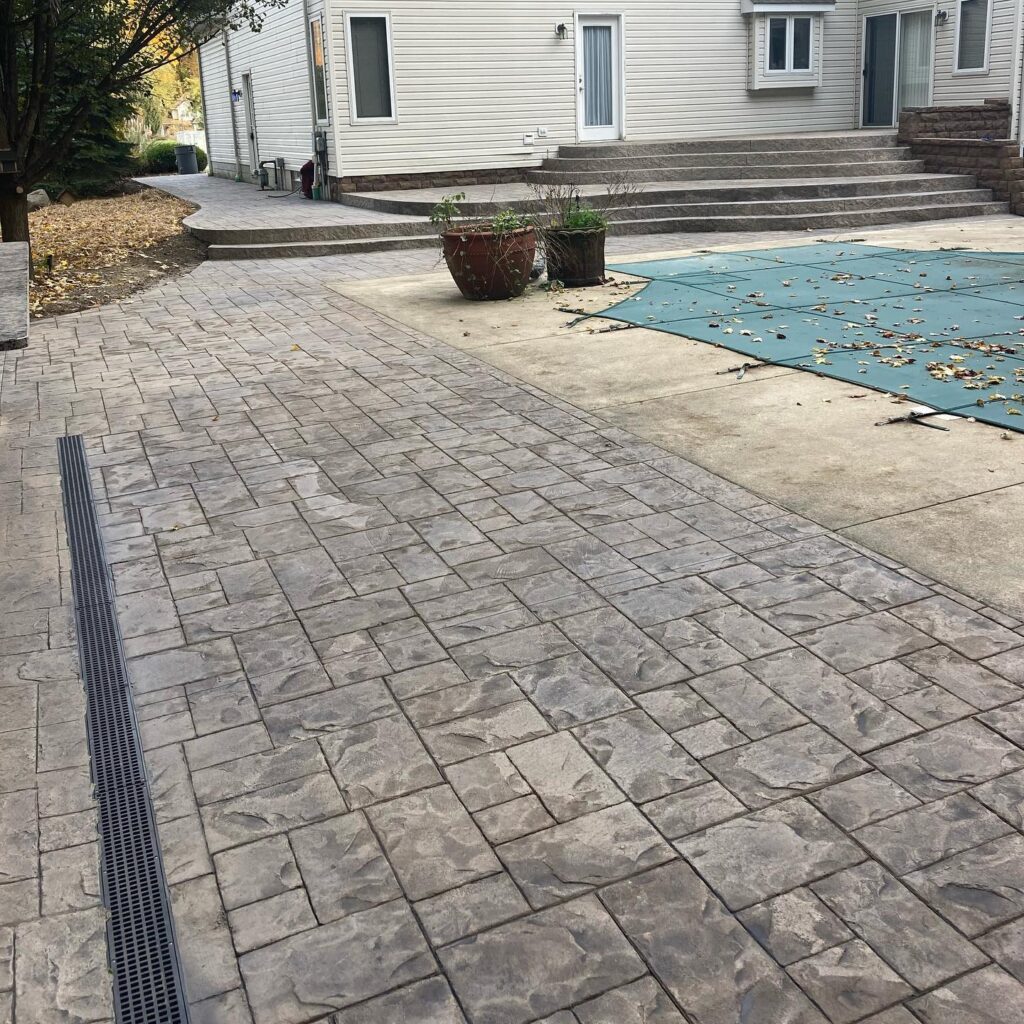 Xpress Construction & Services shows a neat, welcoming patio and porch, with nice landscaping for a cozy family home.