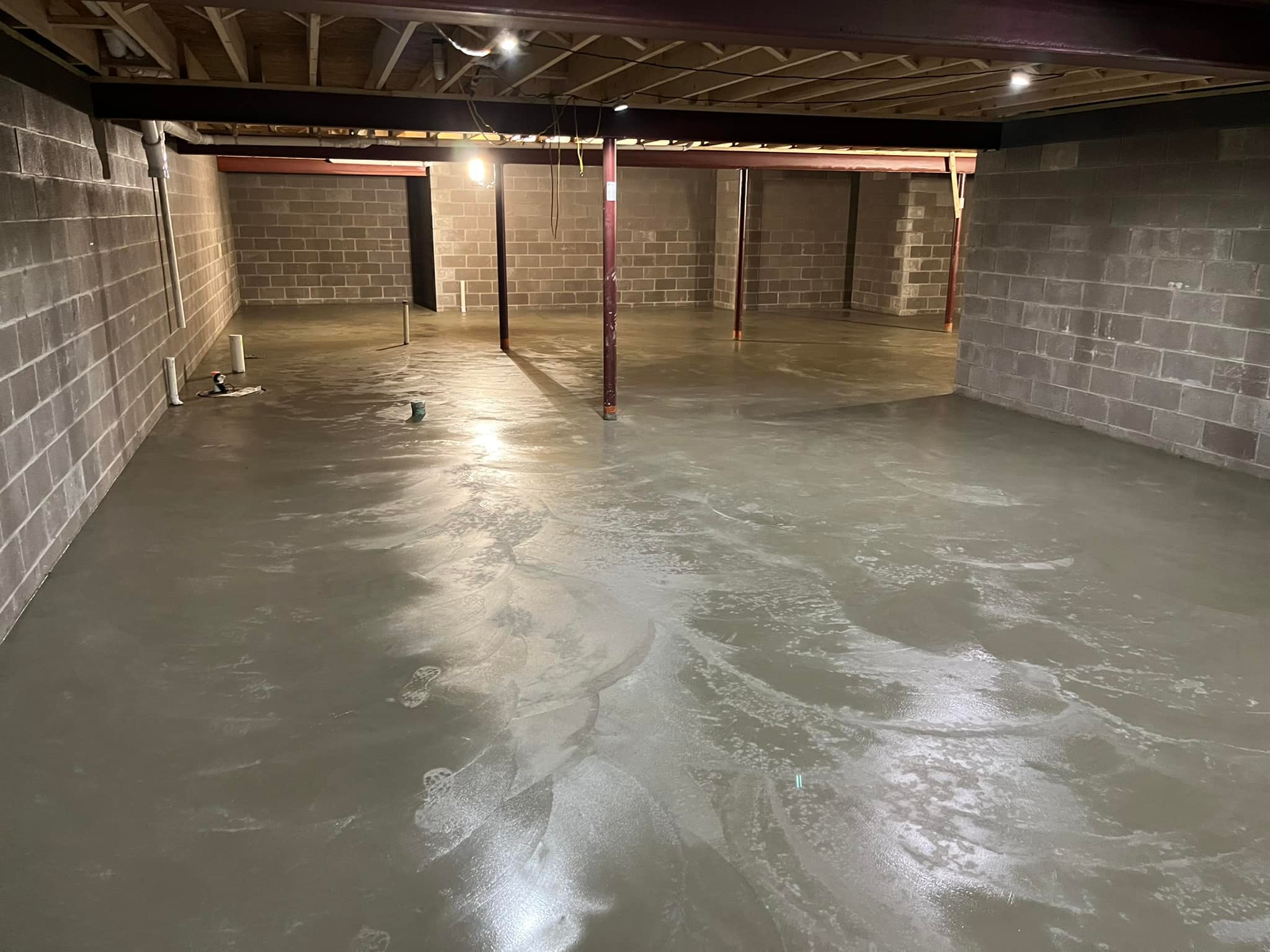 Xpress Construction & Services made this basement strong and safe with new concrete floors and solid support throughout.