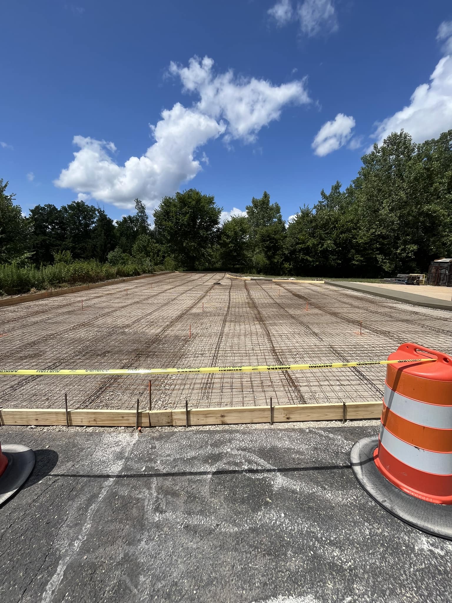 Xpress Construction & Services prepares a safe, secure concrete foundation work site with clear access controls in place.